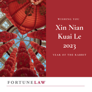 Photo of red lanterns hanging in long columns from a vaulted glass ceiling. Next to the text "Wishing you Xin Nian Kaui Le 2023 Year of the Rabbit" all above the firm logo, Fortune Law the law firm for entrepreneurs, founders and startups.